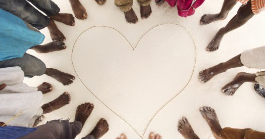 feet-around-heart-on-white-sand-beach-2026-03-26-02-32-09-utc